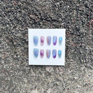 Candy Haze iridescent cat eye press on nails with blue violet and pink reflections