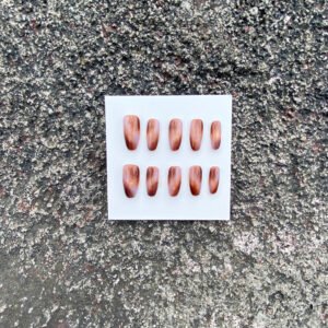 Amber Trace brown cat eye press on nails with warm amber tones and soft reflections